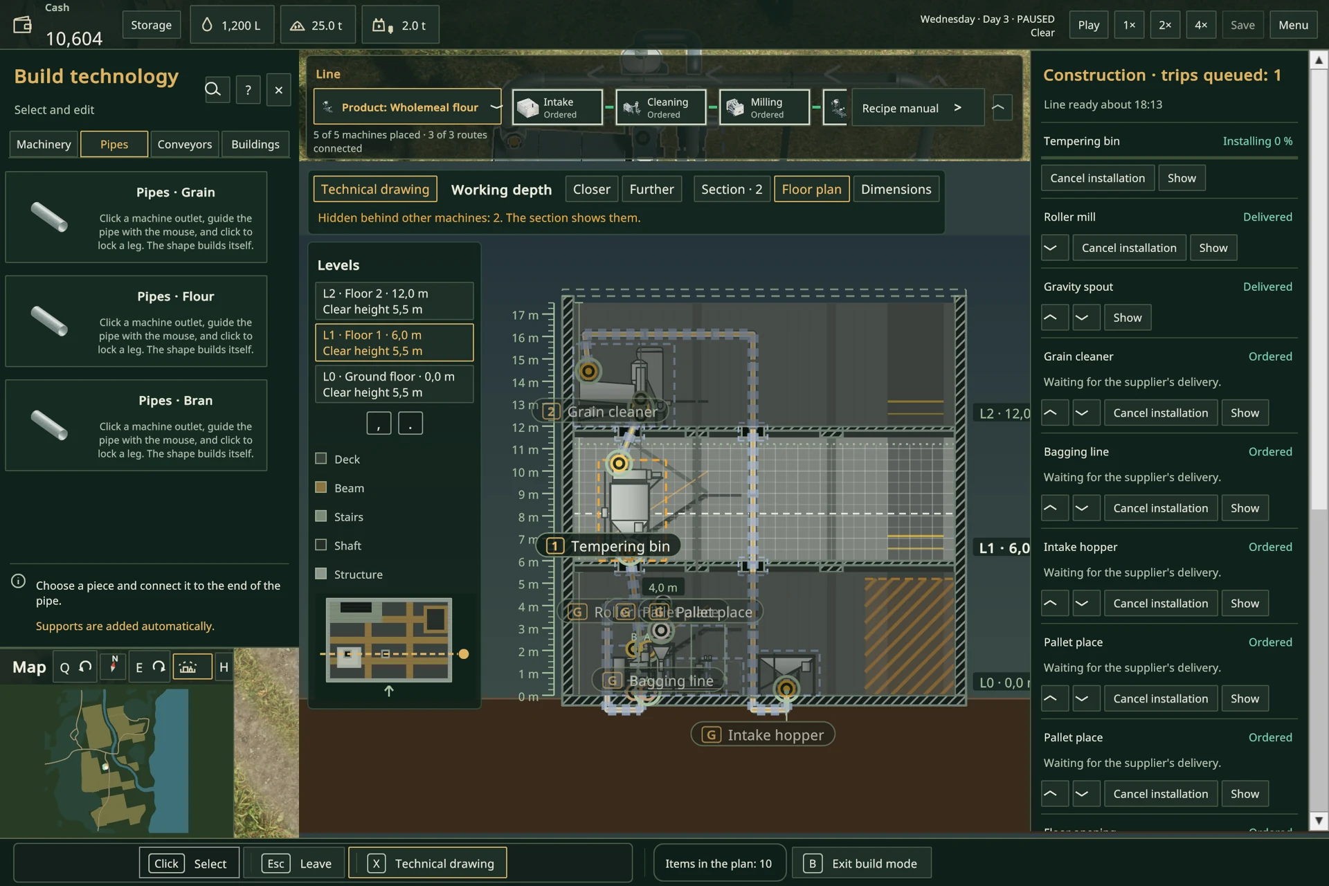The in-game technical drawing shows mill machines under construction on three levels at 0, 6 and 12 metres.